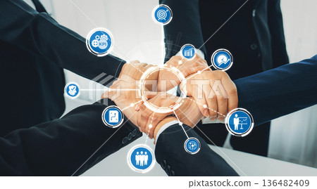 Business Partnership and Teamwork Concept with Hands Joining, KPI Icons, and Success Symbols in Modern Office Environment. Amity 136482409