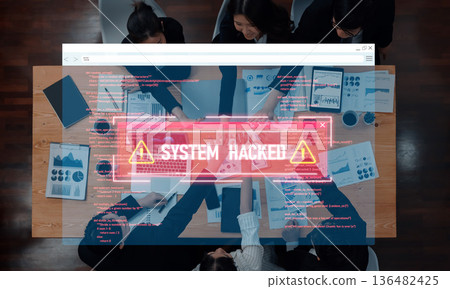 High Angle View of Business Team Collaborating Over Table with Data Analysis and Alert Notification of System Hack Displayed on Screen Trope High Angle View of Business Team Collaborating Over Table with Data Analysis and Alert Notification of System Hack Displayed on Screen Trope 136482425