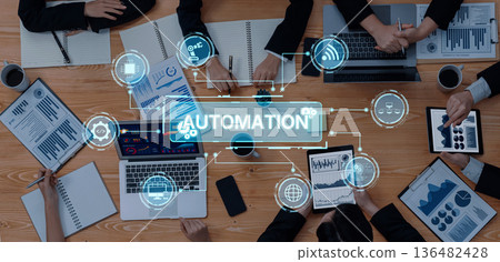 Modern Business Meeting Focused on Automation and Data Analysis with Digital Graphics and Technology Integration in Professional Environment Trope 136482428