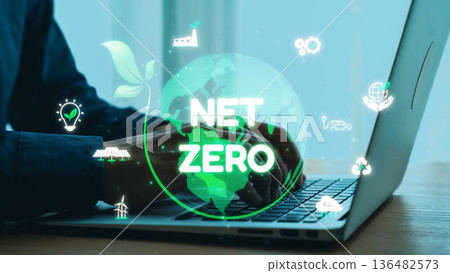 Hands Typing on Laptop with Green Earth Overlay Representing Net Zero Emissions, Sustainability, and Environmental Responsibility Concept. Qubit Hands Typing on Laptop with Green Earth Overlay Representing Net Zero Emissions, Sustainability, and Environmental Responsibility Concept. Qubit 136482573
