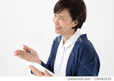 A woman taking an interview A woman taking an interview 136482620
