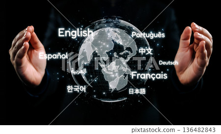 Hands Holding a Digital Globe with Language Options Reflecting Global Communication and Multilingualism in an Interconnected World. Qubit 136482843