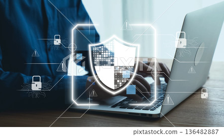 Digital security concept illustrating cybersecurity protection with shield symbol on laptop keyboard showcasing technology in modern workspace environment. Qubit Digital security concept illustrating cybersecurity protection with shield symbol on laptop keyboard showcasing technology in modern workspace environment. Qubit 136482887