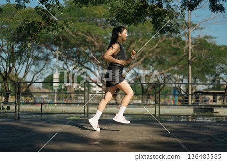 woman running in the park 136483585