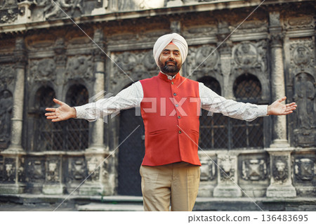 Indian man in a city. Male in a traditional turban. Hinduist in a summer city. Indian man in a city. Male in a traditional turban. Hinduist in a summer city. 136483695