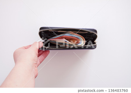 Stylish purple leather wallet with euro notes. Financial readiness and subtle luxury. 136483760