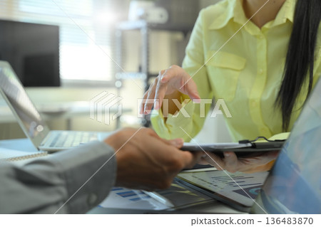 Financial analysis business financial meeting with document and tablet on the table Financial analysis business financial meeting with document and tablet on the table 136483870