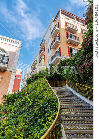 Close-Up of Curved Tiled Staircase in Sunset Town 136484103