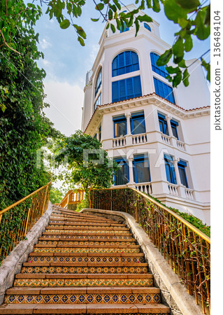 Ornate Tiled Staircase Leading to Mediterranean Villa 136484104