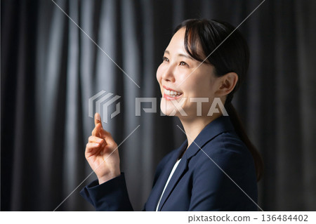 A woman in a suit A woman in a suit 136484402