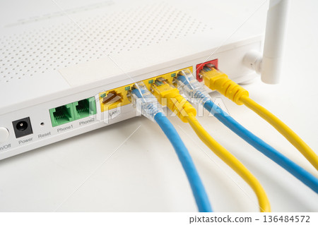 Ethernet cable with wireless router connect to internet service provider internet network. Ethernet cable with wireless router connect to internet service provider internet network. 136484572