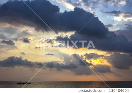The sky is at dawn. The sky over the Indian Ocean at dawn. 136484604