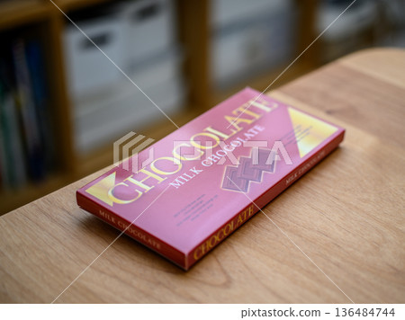 Milk chocolate on the desk 136484744