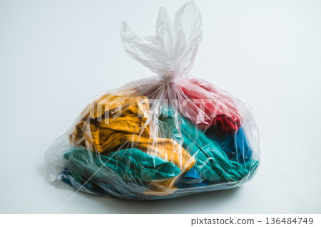Plastic bag containing clothing Plastic bag containing clothing 136484749