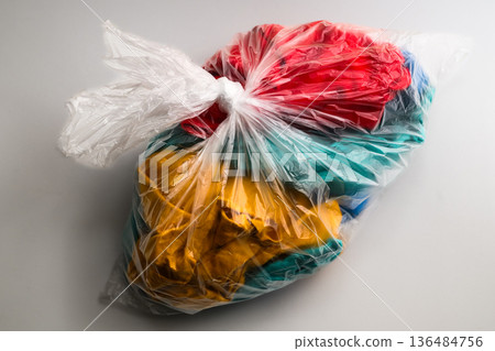 Clothes in a garbage bag 136484756