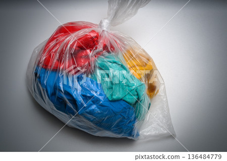 Clothes in plastic bags Clothes in plastic bags 136484779
