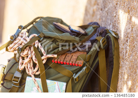 Hiking backpack camping equipment outdoor on grunge wall Hiking backpack camping equipment outdoor on grunge wall 136485180