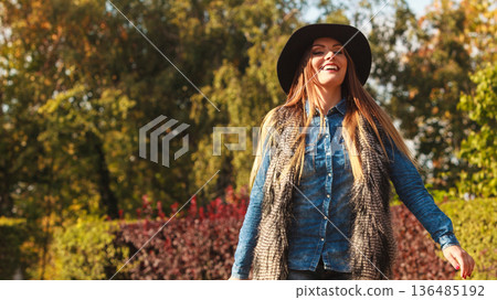 Cheerful woman having fun outdoors 136485192