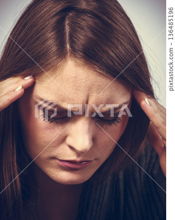 Young woman with painful headache Young woman with painful headache 136485196