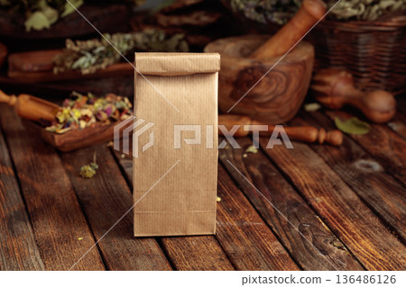 Tall brown paper bag on an old wooden table. 136486126