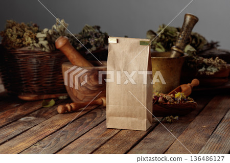 Tall brown paper bag on an old wooden table. 136486127