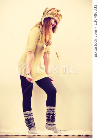 Beautiful winter woman in warm clothing Beautiful winter woman in warm clothing 136486332
