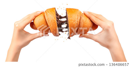 Woman breaking croissant with melted chocolate filling stretch isolated on white 136486657