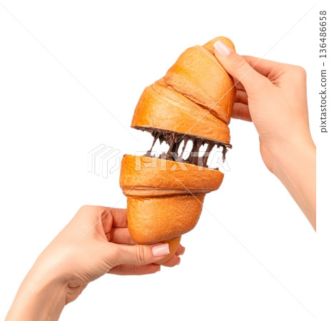 Woman holding croissant halves with stretchy chocolate filling isolated on white 136486658