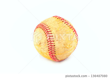 Old worn softball with red stitching isolated on white background 136487080