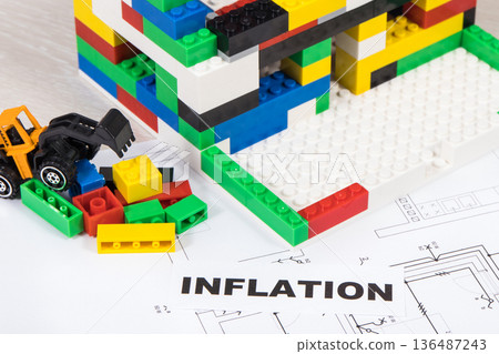Electrical diagrams of house with building under construction made of blocks, inscription inflation Electrical diagrams of house with building under construction made of blocks, inscription inflation 136487243