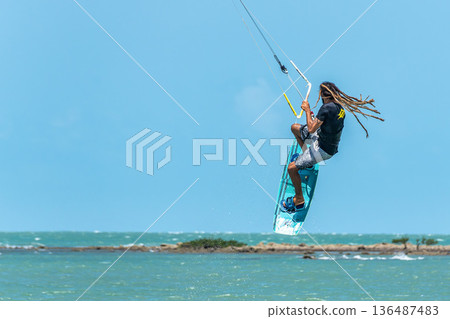Barra Grande, Brazil - Jan 22, 2026: Kite surfing at Barra Grande beach on the coast of Piaui, northeastern Brazil. Barra Grande, Brazil - Jan 22, 2026: Kite surfing at Barra Grande beach on the coast of Piaui, northeastern Brazil. 136487483