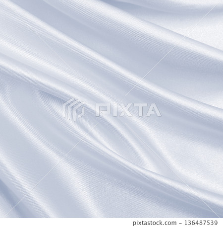 Smooth elegant grey silk or satin luxury cloth as wedding background. Luxurious Christmas background or New Year background design Smooth elegant grey silk or satin luxury cloth as wedding background. Luxurious Christmas background or New Year background design 136487539
