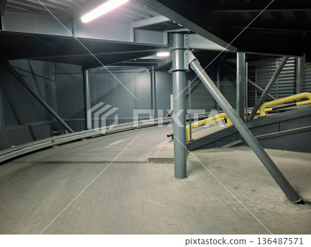 Car access road to the supermarket parking area Car access road to the supermarket parking area 136487571