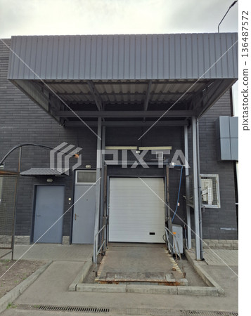 There is a loading dock at the rear of the grocery store 136487572