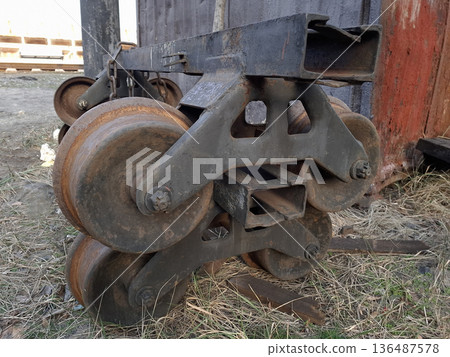 Metal wheels from handcar. An old wheel pair from handcar near the railroad Metal wheels from handcar. An old wheel pair from handcar near the railroad 136487578