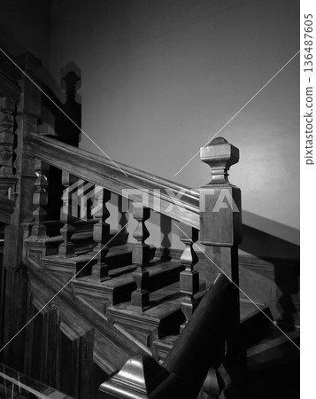 The mansion staircase is hidden in gloom, black-and-white photo 136487605