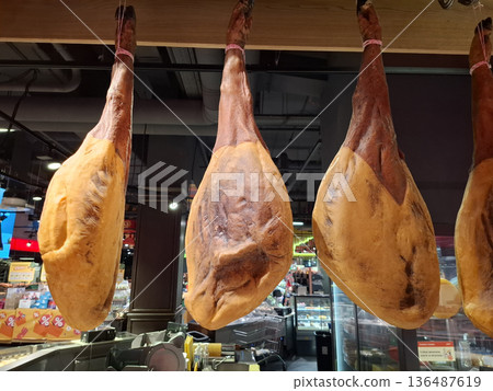 Beef. Large cows legs are sold in a grocery store 136487619