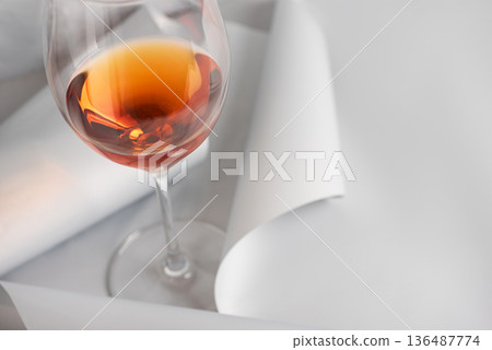 Rose Wine Glass on Minimal White Background. Elegant Modern Beverage Concept Rose Wine Glass on Minimal White Background. Elegant Modern Beverage Concept 136487774