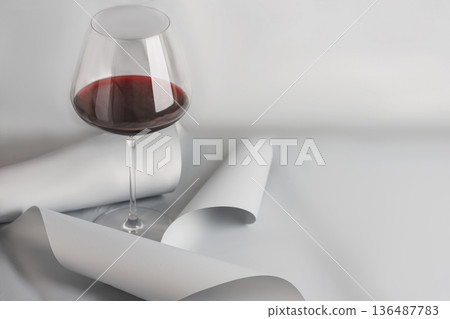 Red Wine Glass on Minimal Gray Background. Elegant Modern Beverage Concept Red Wine Glass on Minimal Gray Background. Elegant Modern Beverage Concept 136487783