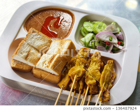 A set of grilled pork satay A set of grilled pork satay 136487924