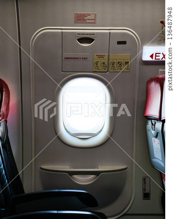 emergency exit door on an airplane 136487948