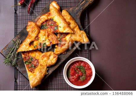 Savory Pastries Arranged Artistically With Dipping Salsa On A Table 136488066