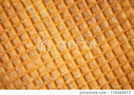 Close-Up Of A Textured Wafer Showcasing Grid Patterns And Warmth. Close-Up Of A Textured Wafer Showcasing Grid Patterns And Warmth. 136488072