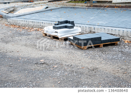 Pavement tiles for road sidewalk repair. Construction process and urban infrastructure in big city. 136488648
