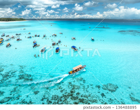 Aerial view of colorful boats and yachts in transparent water Aerial view of colorful boats and yachts in transparent water 136488895