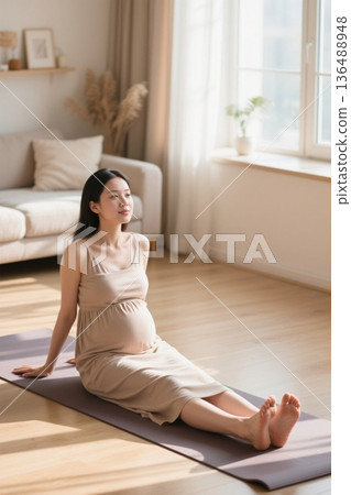 Pregnant woman rests on yoga mat at home 136488948
