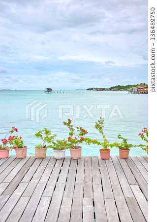 Wooden platform by the sea, holiday relaxation concept, Borneo, Malaysia. Wooden platform by the sea, holiday relaxation concept, Borneo, Malaysia. 136489750