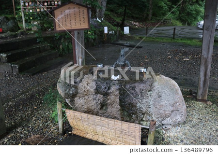 Gozanoishi Shrine on the shores of Lake Tazawa on a rainy day, Akita Prefecture, Tohoku 136489796
