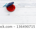 Castanets placed on a white wood background 136490715