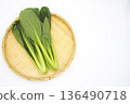 Fresh komatsuna in a colander on a white background 136490718